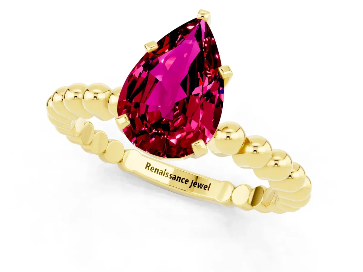 Pear Cut Garnet Solitaire Ring with Beaded Band and Prong Setting Yellow gold