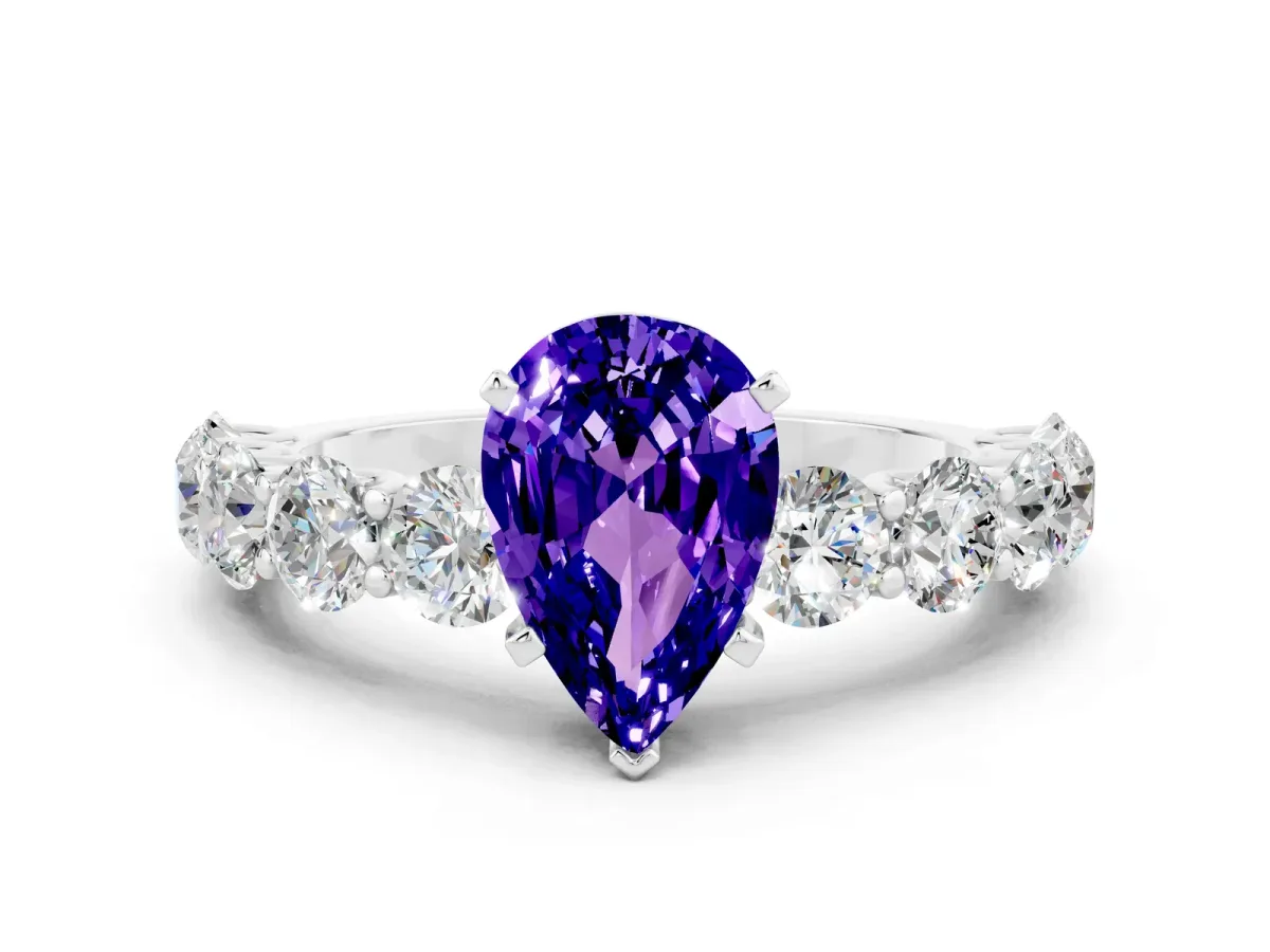 Pear Cut Tanzanite Prong Setting with Side Stones on a Pave Band Platinum