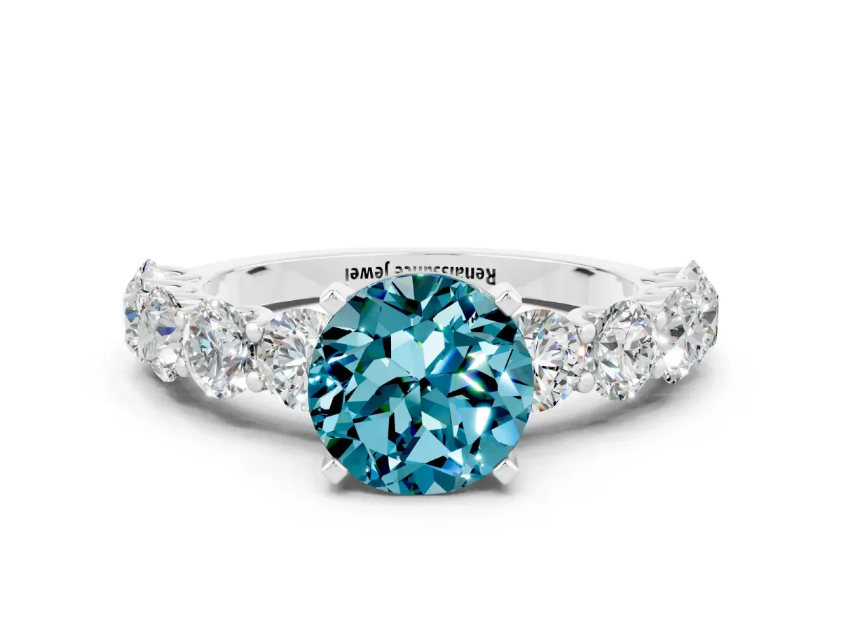 Round Cut Blue Topaz Prong Setting with Side Stones on a Pave Band Silver