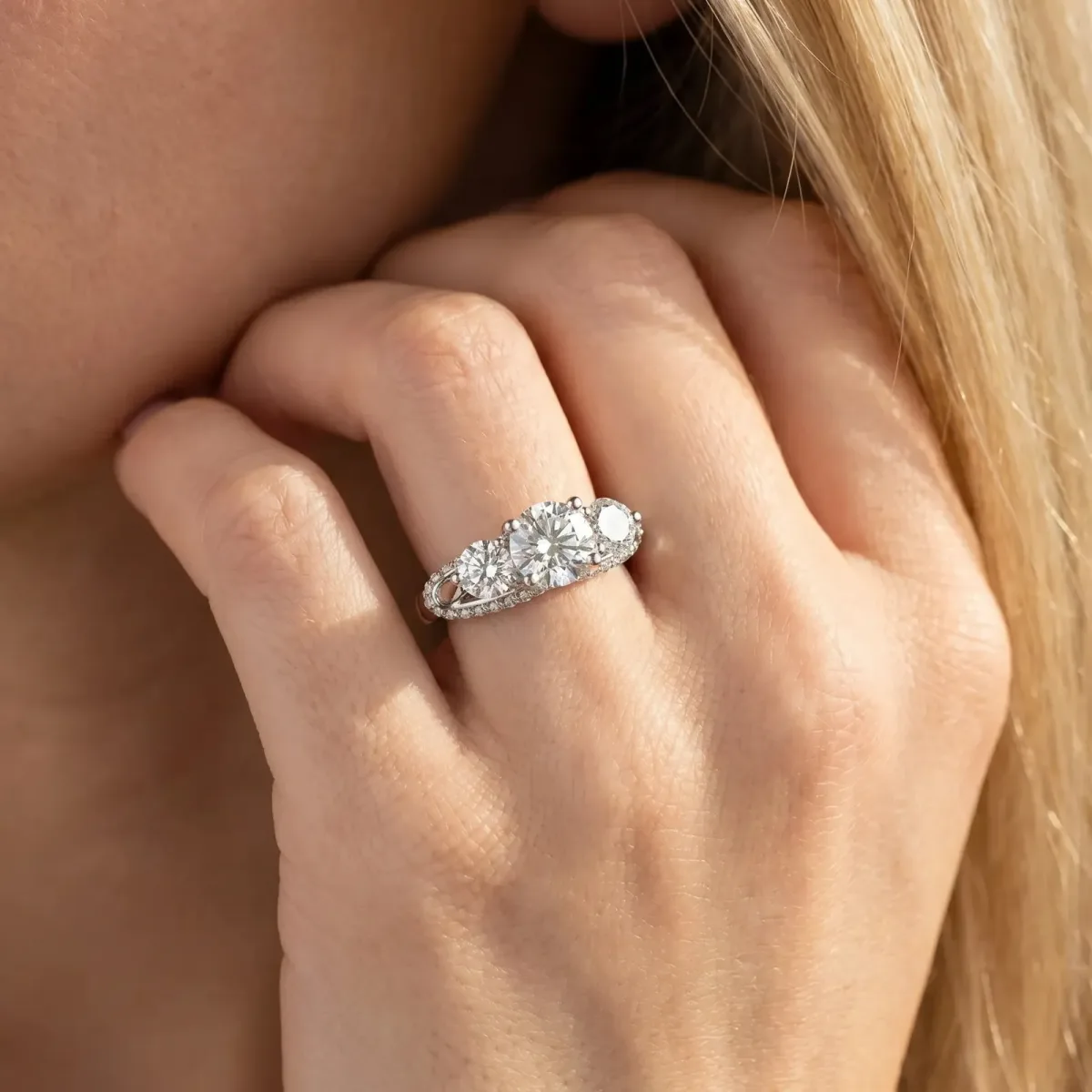 Round Cut Diamond Three-Stone Ring with Prong Setting and Pavé Band Platinum