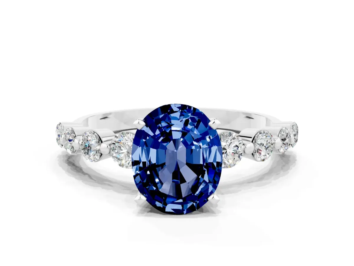 Oval Cut Solitaire Blue Sapphire Ring with Pave Band and Four-Prong Setting Silver