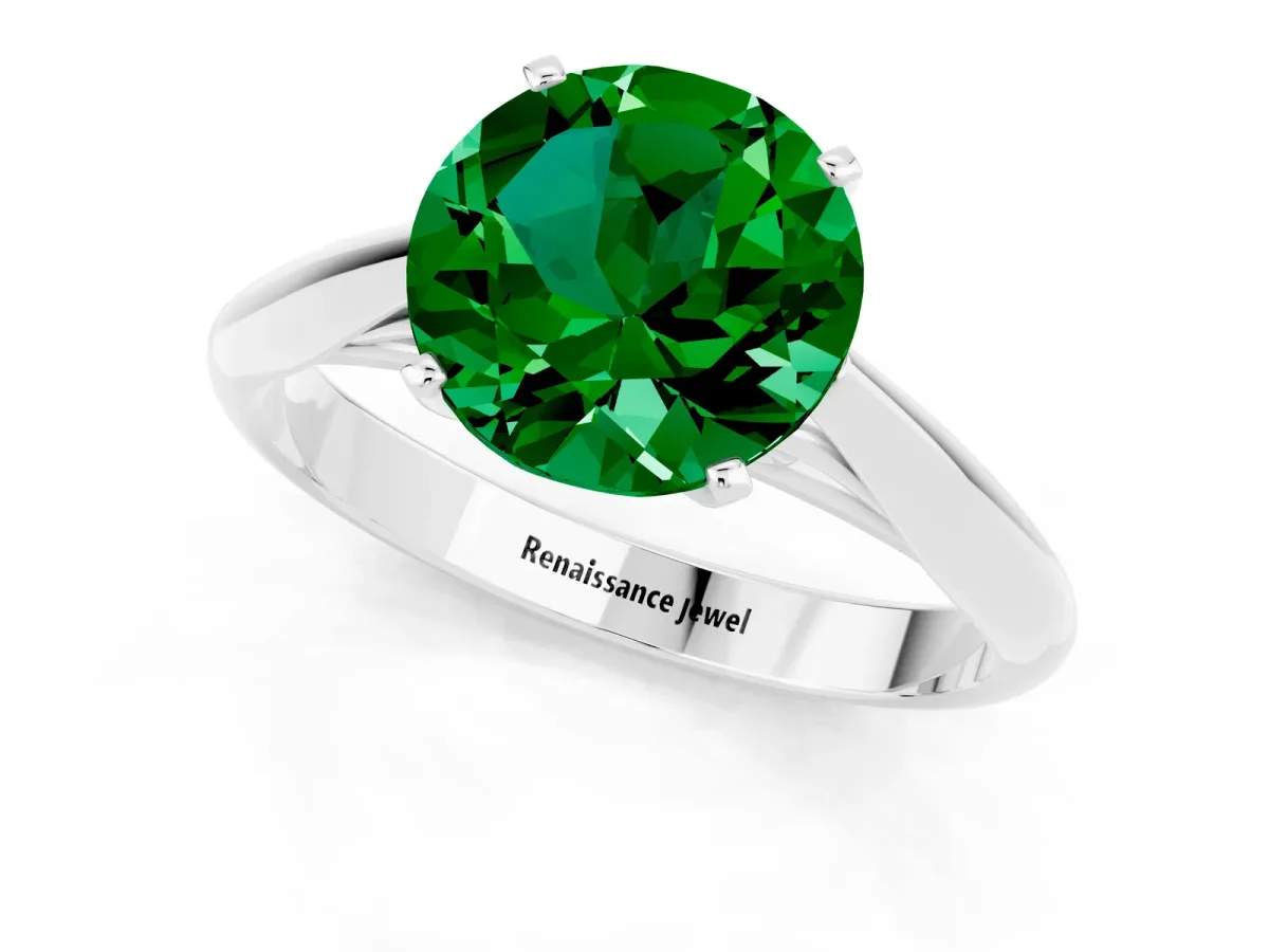 Round Cut Emerald Solitaire Engagement Ring with Cathedral Setting and Four-Prong Mount White gold
