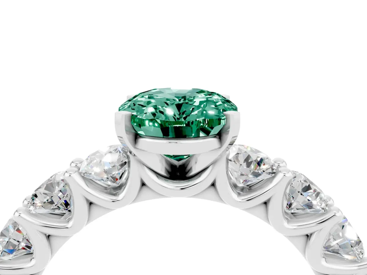 Oval Cut Green Sapphire Prong Setting with Side Stones on a Pave Band Silver