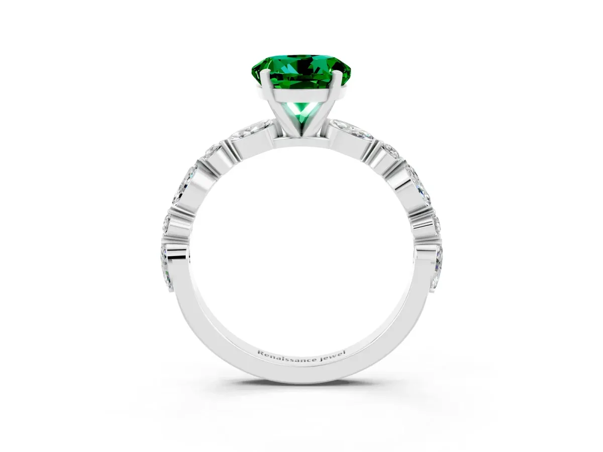 Round Cut Emerald Ring with Marquise and Round Side Stones and Four-Prong Setting Silver