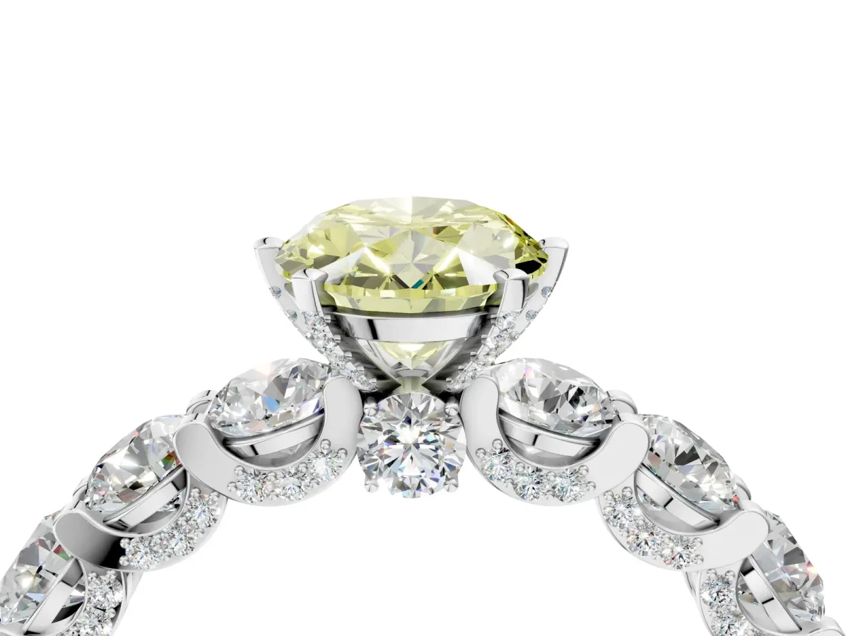 Fancy Yellow Oval Cut Diamond Side Stone Engagement Ring with Four-Prong Setting White gold