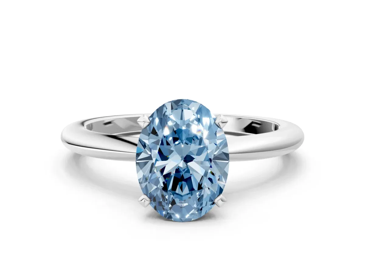 Fancy Blue Oval Cut Diamond Solitaire Ring with Six-Prong Setting and Classic Band Platinum