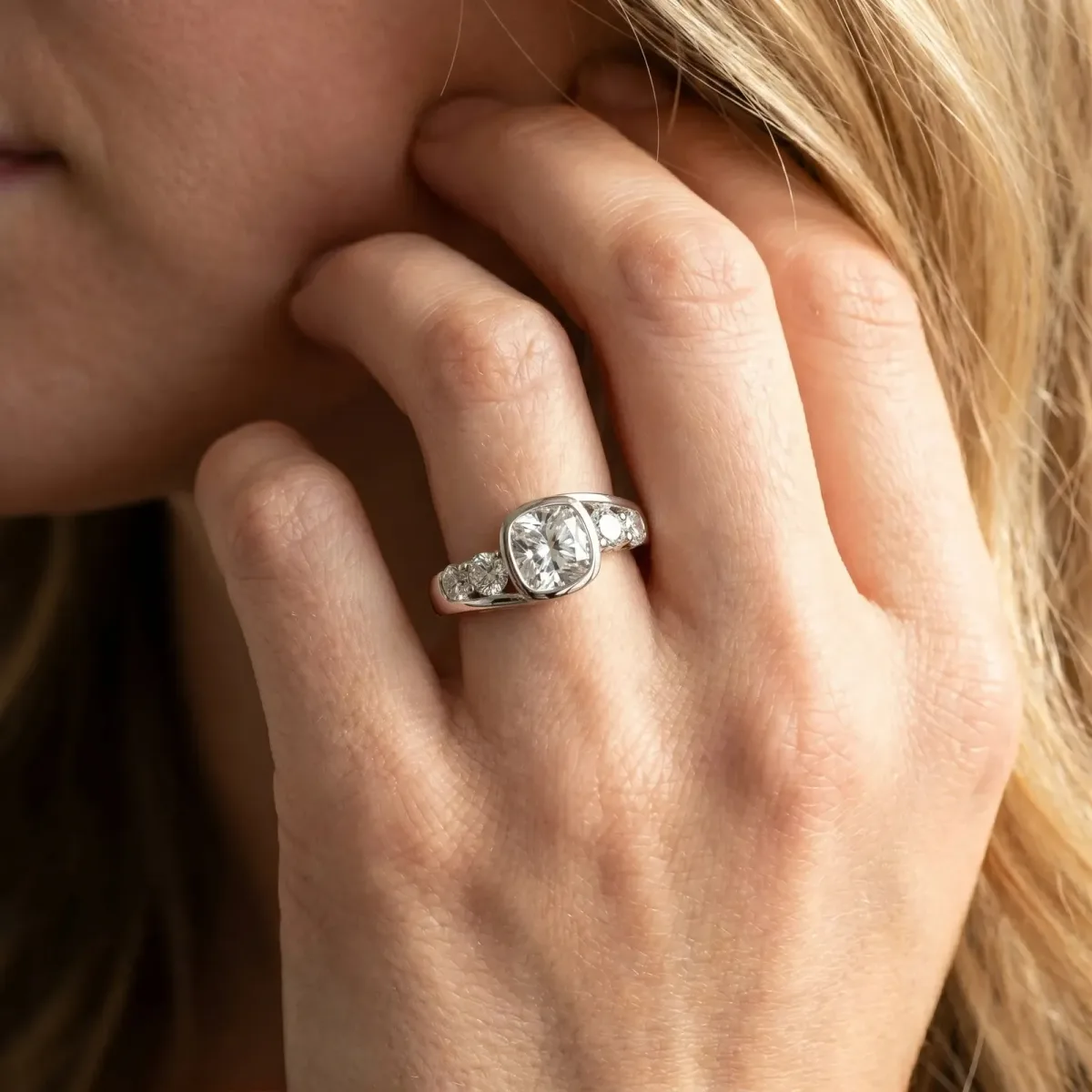 Bezel Set Cushion Cut Diamond Bypass Ring with Round Accents Platinum