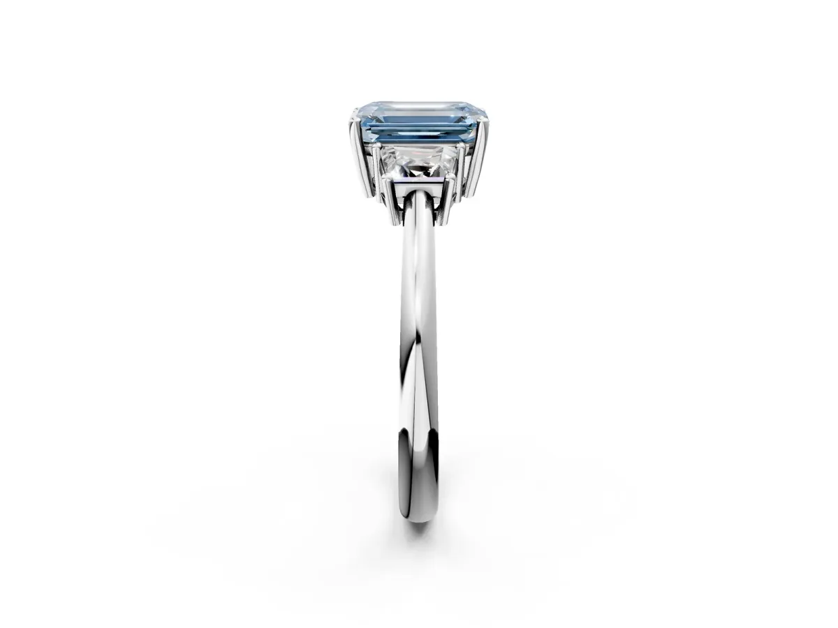 Fancy Blue Emerald Cut Diamond Three-Stone Ring with Trapezoid Side Stones and Prong Setting Silver