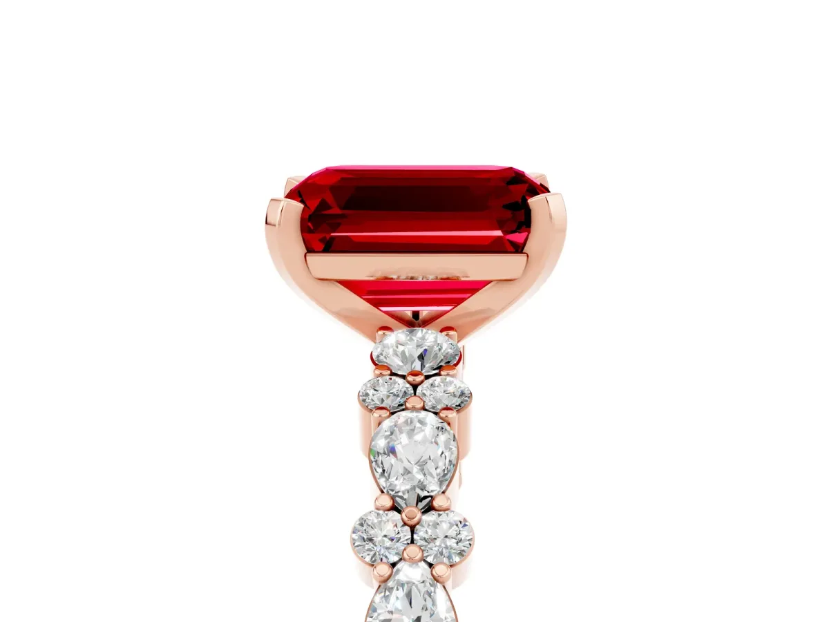 Emerald Cut Ruby Side Stone Solitaire Ring with Round and Four-Prong Setting Rose gold