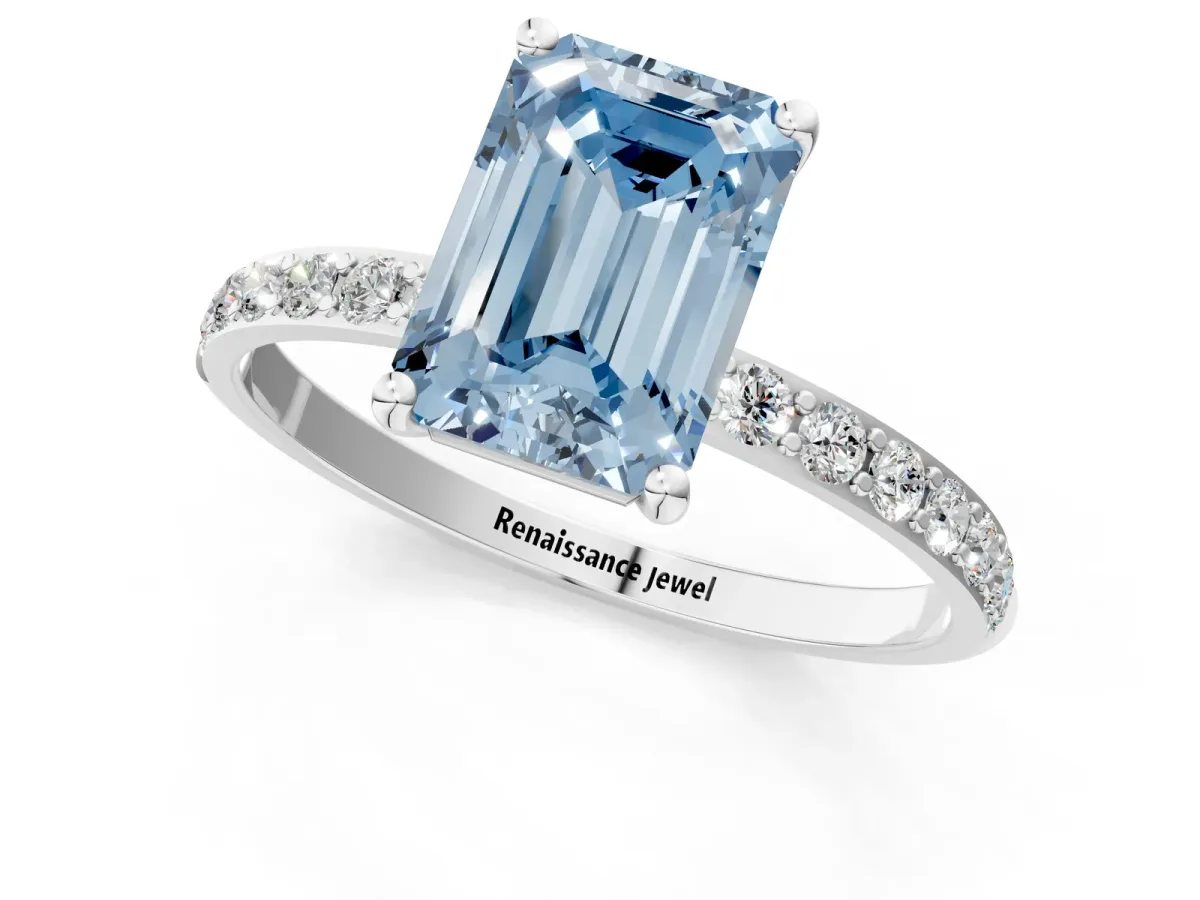 Fancy Blue Emerald Cut Diamond Solitaire Ring with Round Pavé Shoulders and Prong Setting Silver