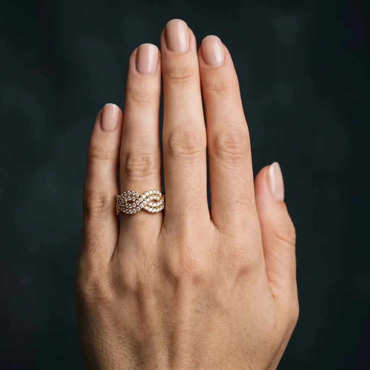 Pavé Round Diamond Infinity Twist Band with Shared Prong Setting Yellow gold