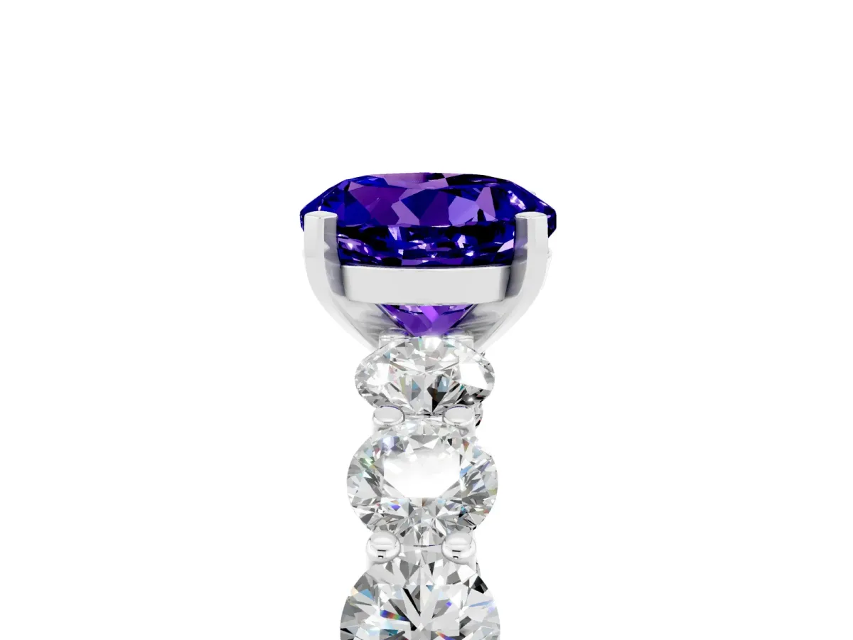 Round Cut Tanzanite Prong Setting with Side Stones on a Pave Band Silver