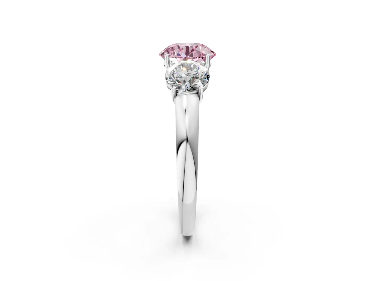 Fancy Pink Round Cut Diamond Three-Stone Ring with Four-Prong Setting and Classic Band Platinum