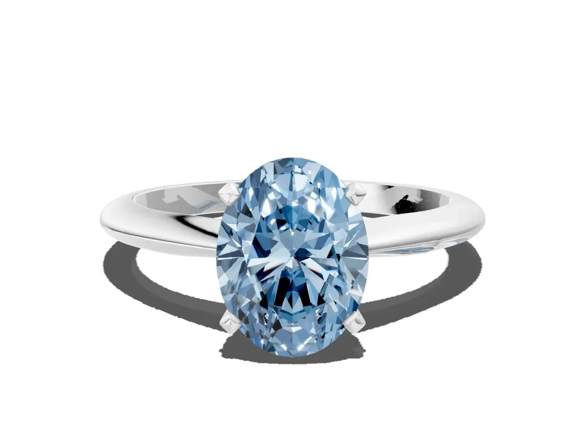 Fancy Blue Oval Cut Diamond Solitaire Engagement Ring with Classic Band and Four-Prong Setting Silver