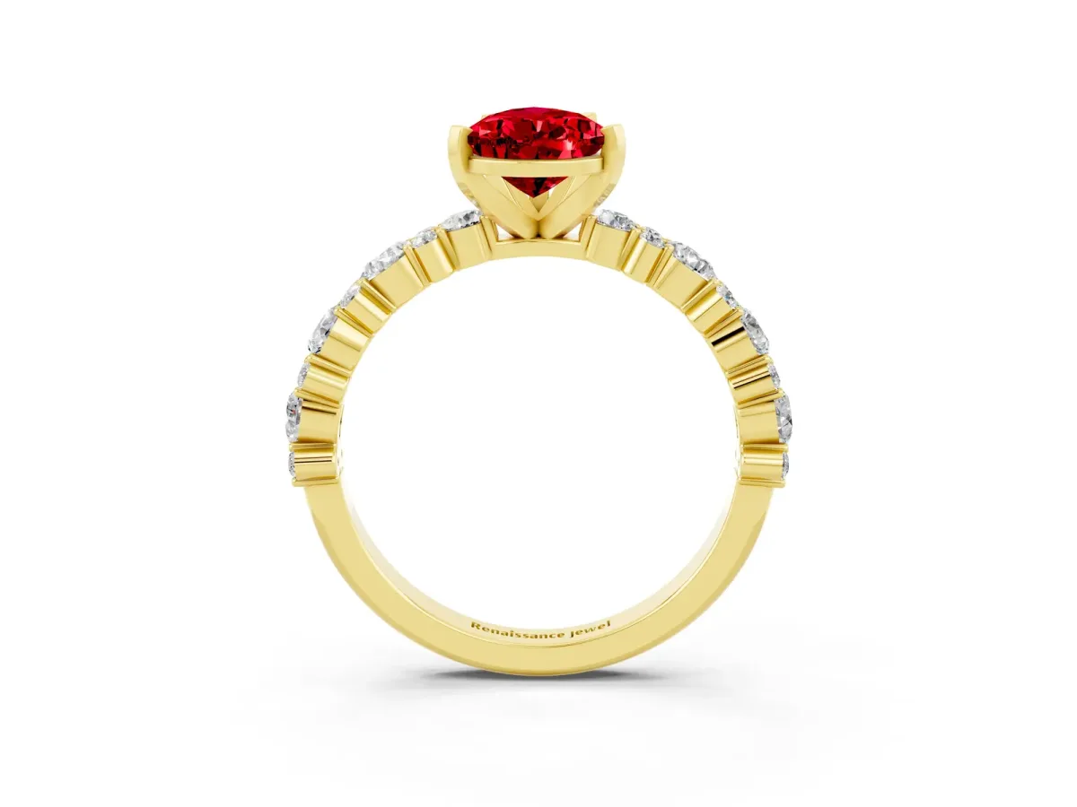 Pear Cut Ruby Side Stone Solitaire Ring with Round and Four-Prong Setting Yellow gold