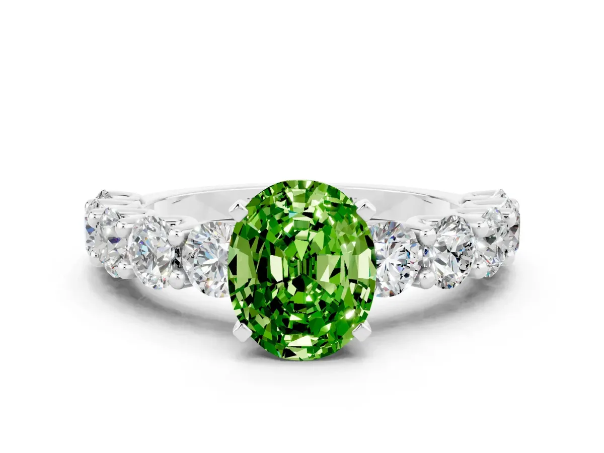 Oval Cut Peridot Prong Setting with Side Stones on a Pave Band Platinum