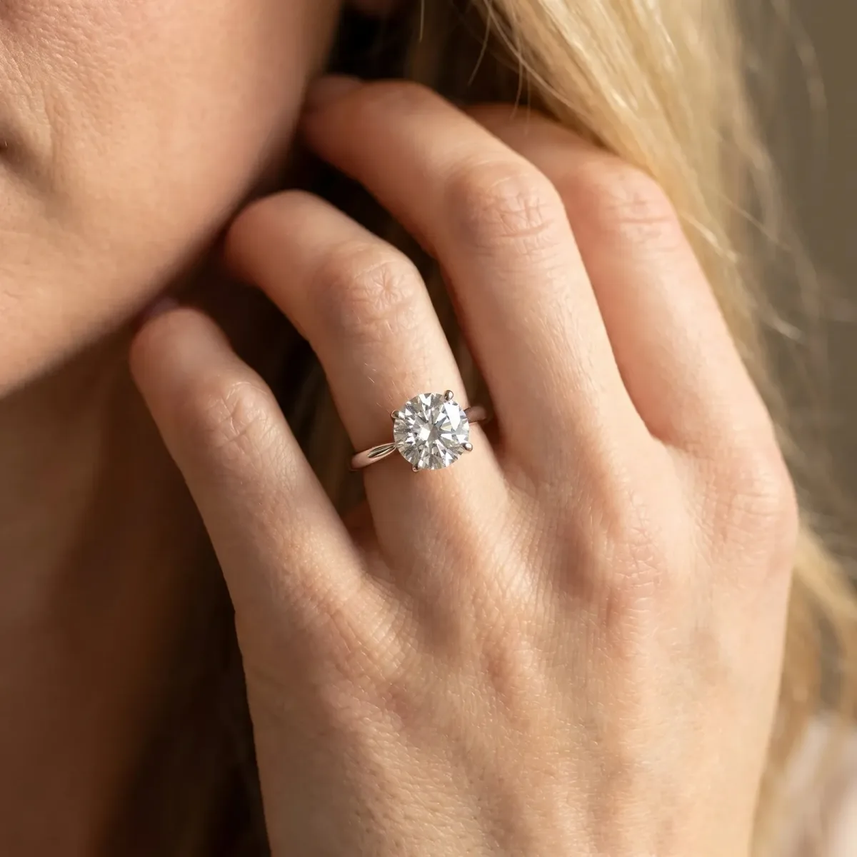 Round Cut Solitaire Twist Band Engagement Ring with Four-Prong Setting Silver