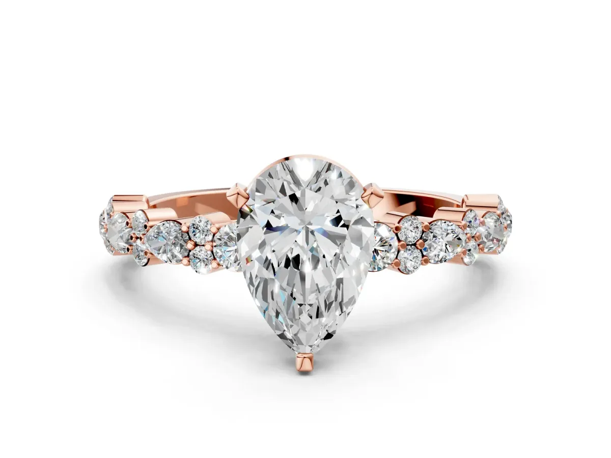 Pear Cut Diamond Side Stone Solitaire Ring with Round and Four-Prong Setting Rose gold