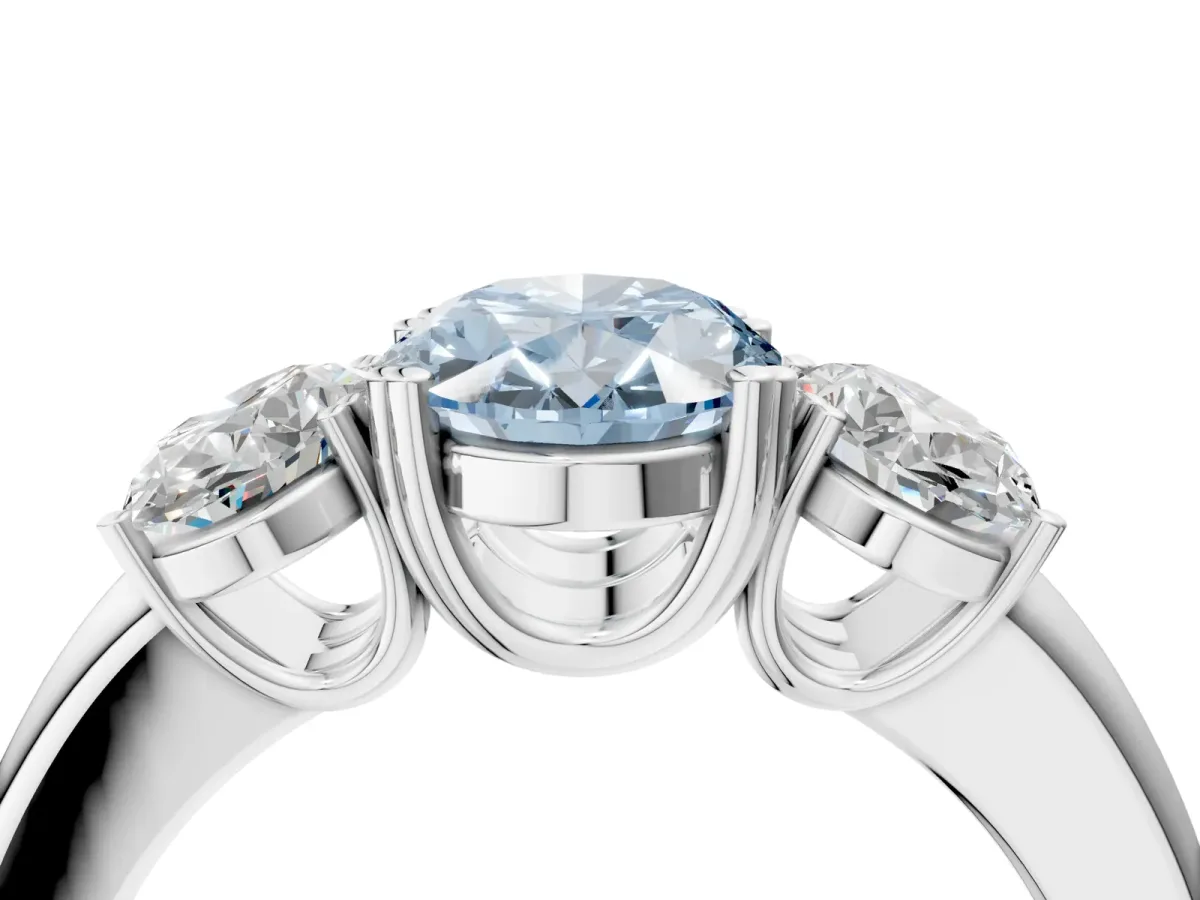 Fancy Blue Three-Stone Oval Cut Cut Diamond Ring with Channel Set Band and Four-Prong Setting Silver