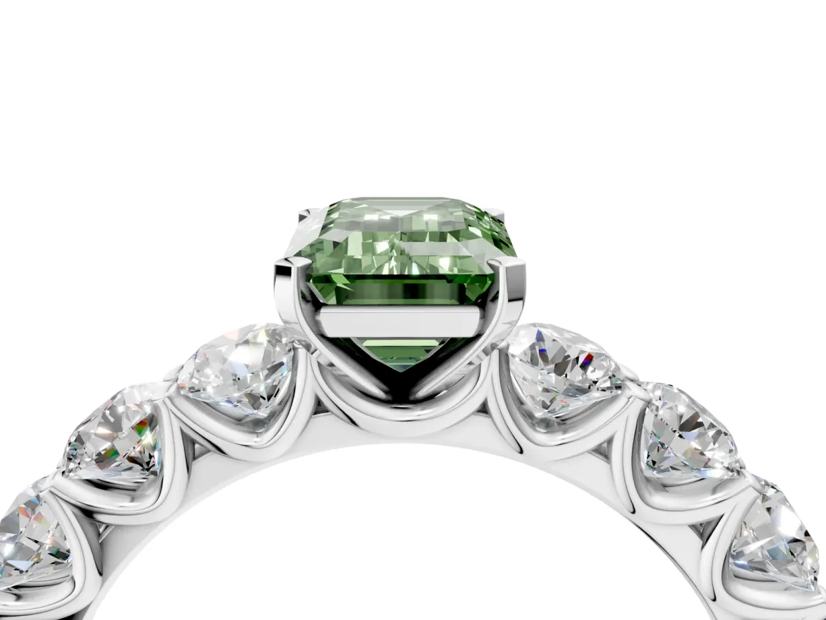 Fancy Green Emerald Cut Diamond Prong Setting with Side Stones on a Pave Band Silver