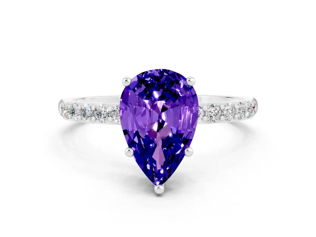 Pear Cut Tanzanite Solitaire Ring with Round Pavé Band and Prong Setting Silver