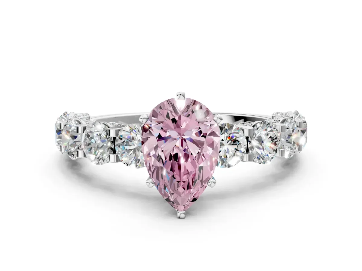 Fancy Pink Pear Cut Diamond Side Stone Engagement Ring with Four-Prong Setting Platinum