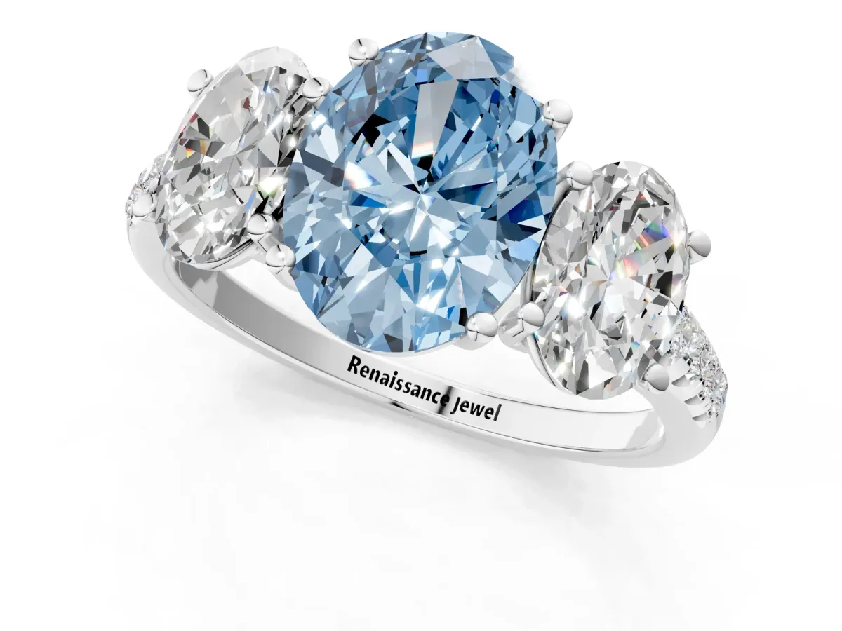 Fancy Blue Three-Stone Oval Cut Diamond Ring with Round Pavé Band and Prong Setting Platinum