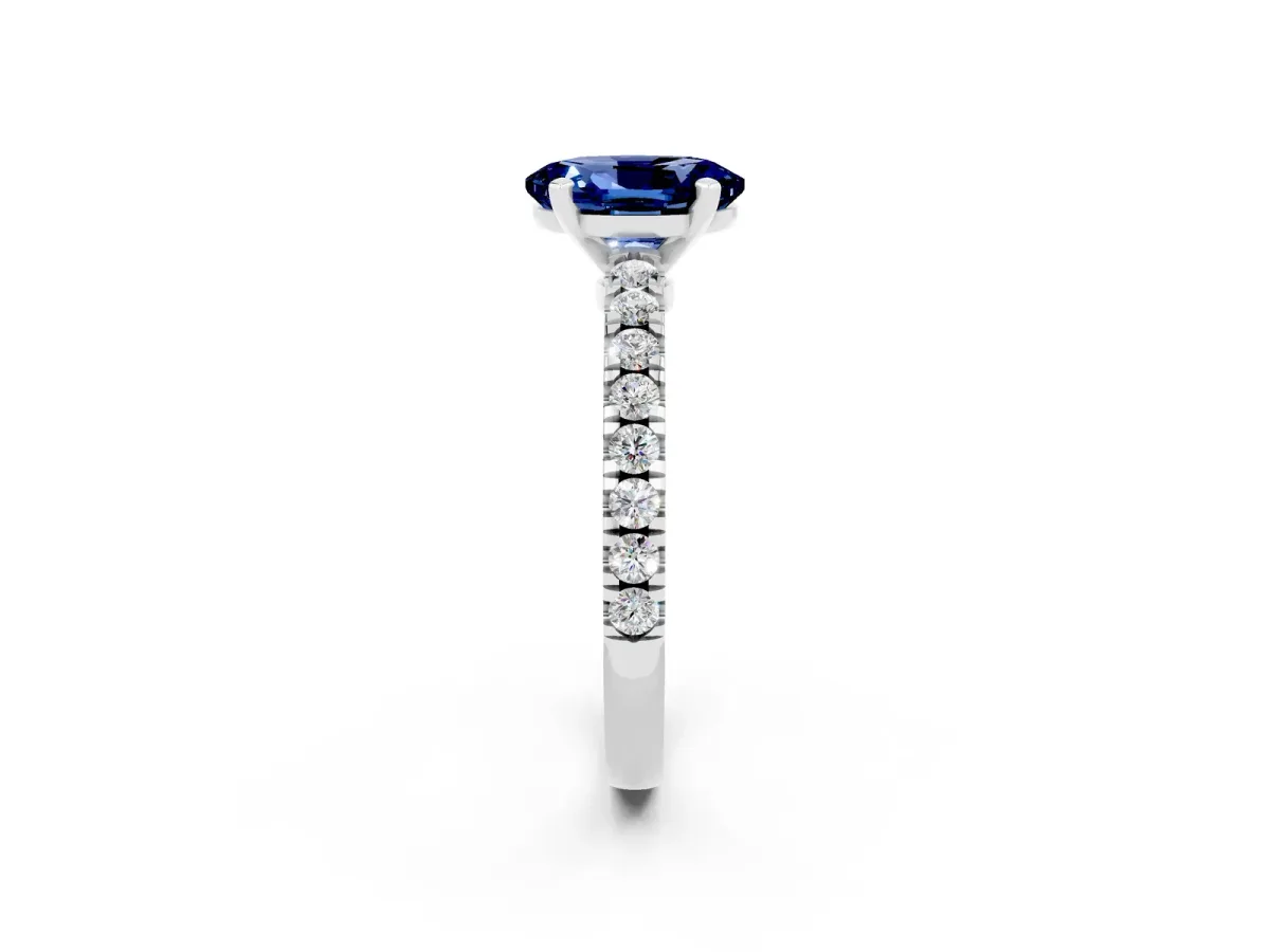 Oval Cut Solitaire Blue Sapphire with Pavé Band and Four-Prong Setting Silver