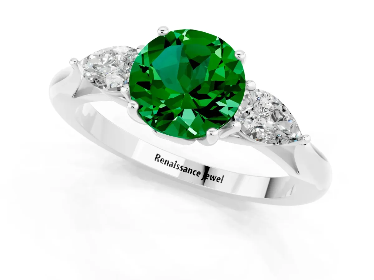 Three-Stone Round Cut Emerald Ring with Pear Side Stones in Four-Prong Setting Platinum