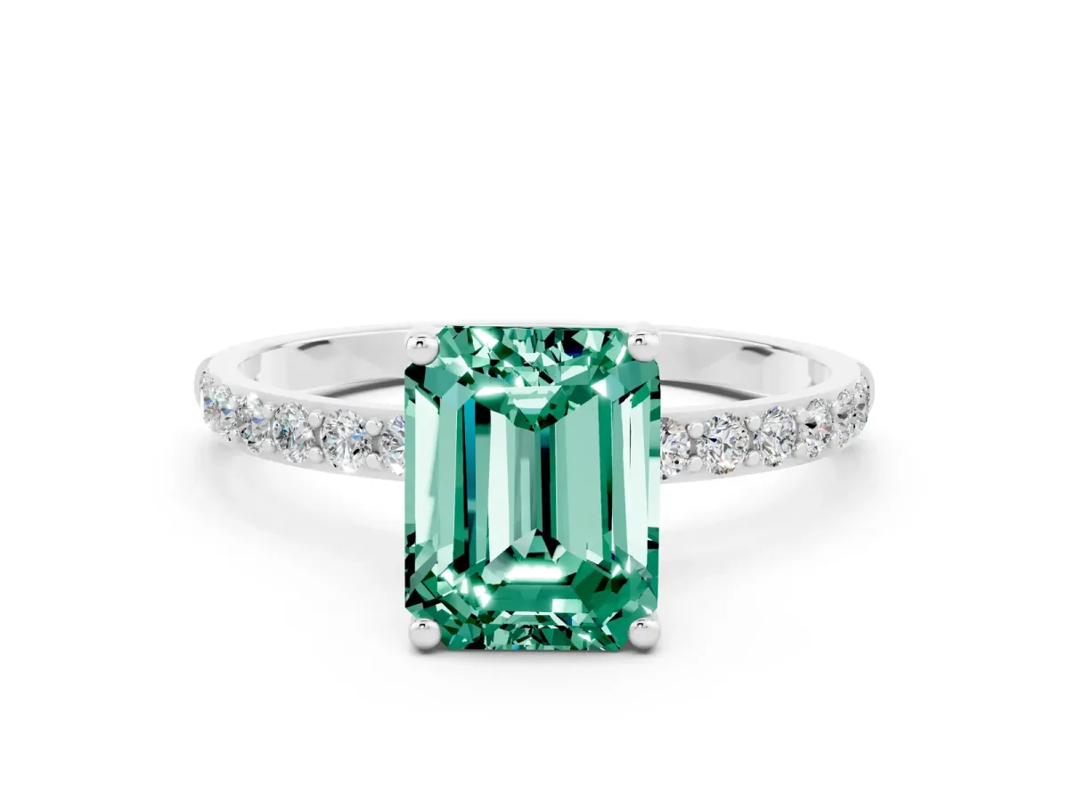 Emerald Cut Green Sapphire Solitaire Ring with Round Pavé Shoulders and Prong Setting Silver