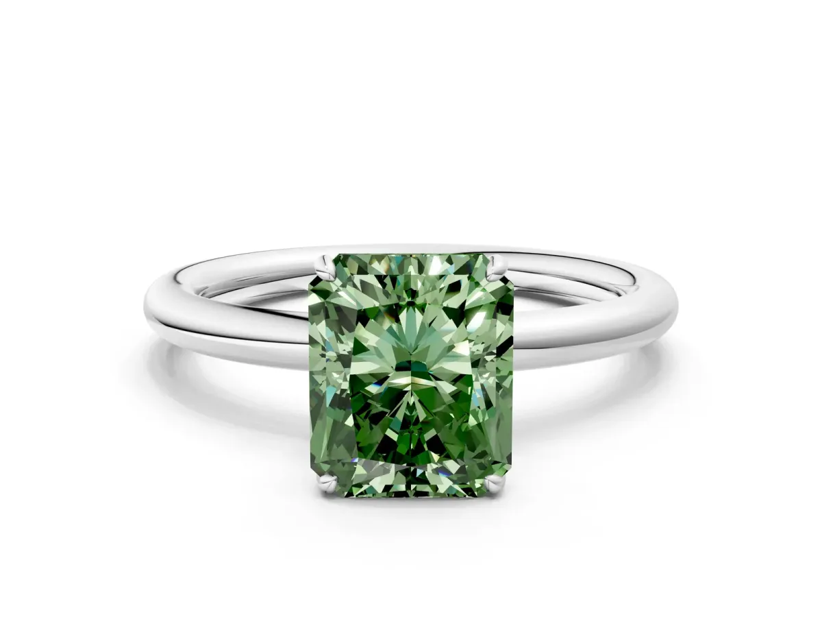 Fancy Green Radiant Cut Solitaire Diamond Ring with Four-Prong Setting on a Plain Band Platinum