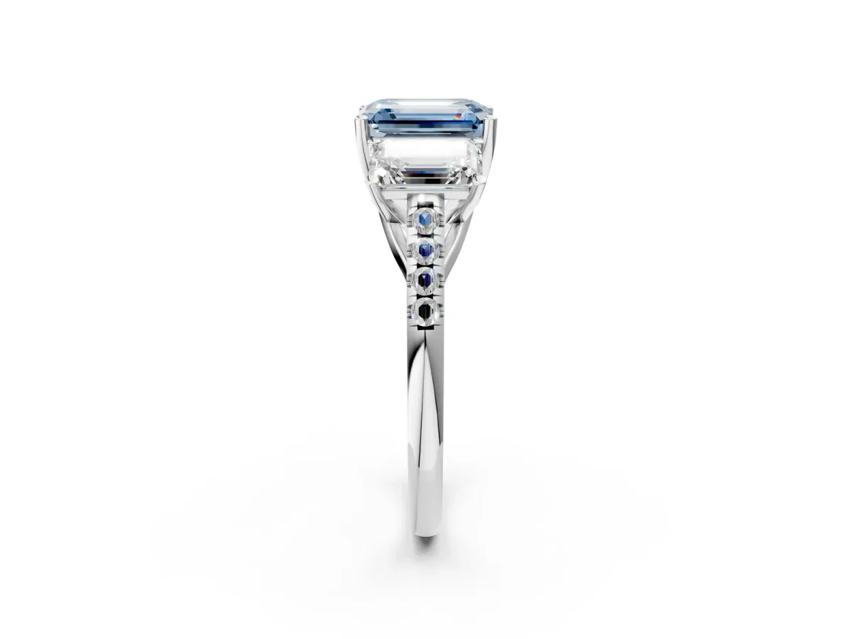 Fancy Blue Three-Stone Emerald Cut Diamond Ring with Round Pavé Band and Prong Setting Silver