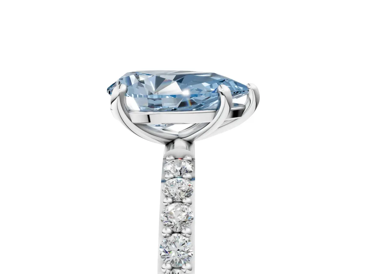 Fancy Blue Pear Cut Diamond Solitaire Ring with Round Pavé Band and Prong Setting Silver