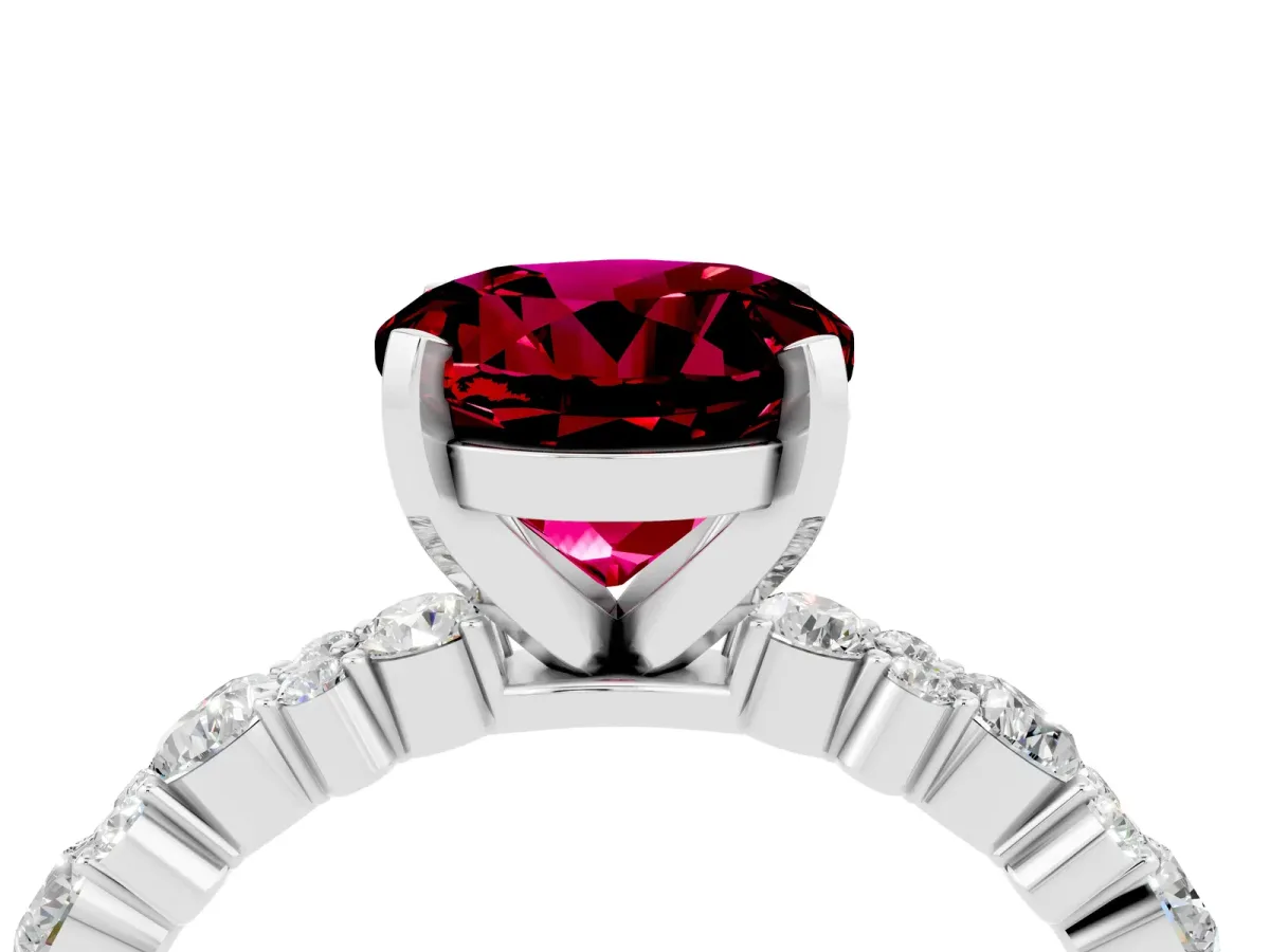 Round Cut Garnet Side Stone Solitaire Ring with Round and Four-Prong Setting Platinum