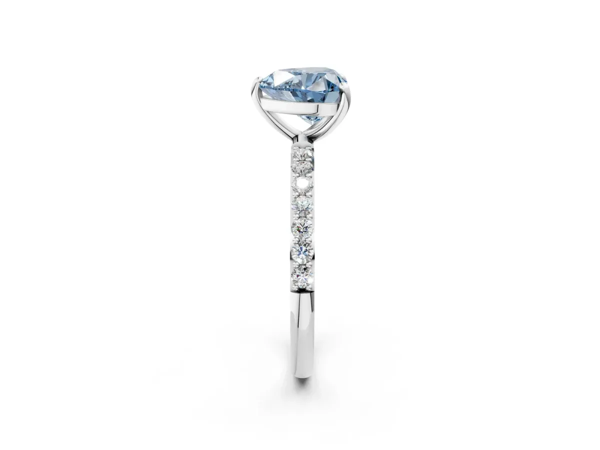 Fancy Blue Heart Cut Diamond Solitaire Ring with Round Pavé Band and Prong Setting Silver