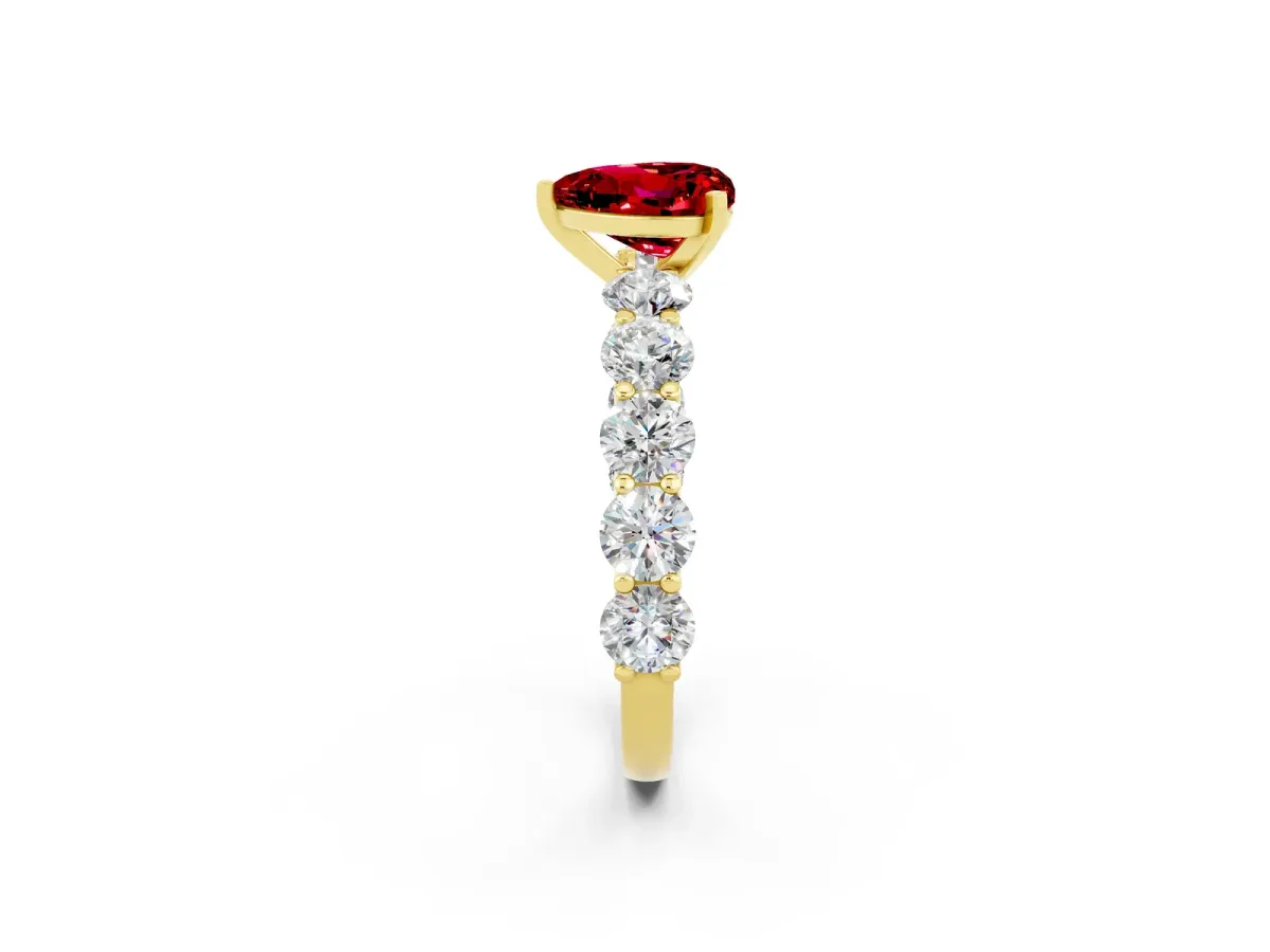 Heart Cut Ruby Prong Setting with Side Stones on a Pave Band Yellow gold