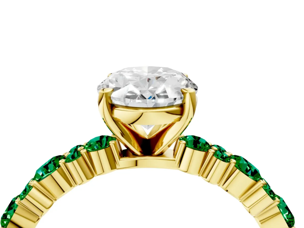 Oval Cut Diamond Side Stone Solitaire Ring with Round Emerald and Four-Prong Setting Yellow gold