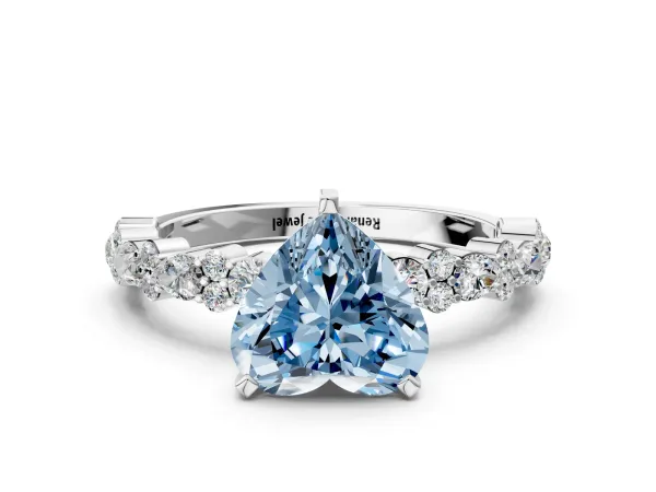 Fancy Blue Heart Cut Diamond Side Stone Solitaire Ring with Round and Four-Prong Setting Platinum