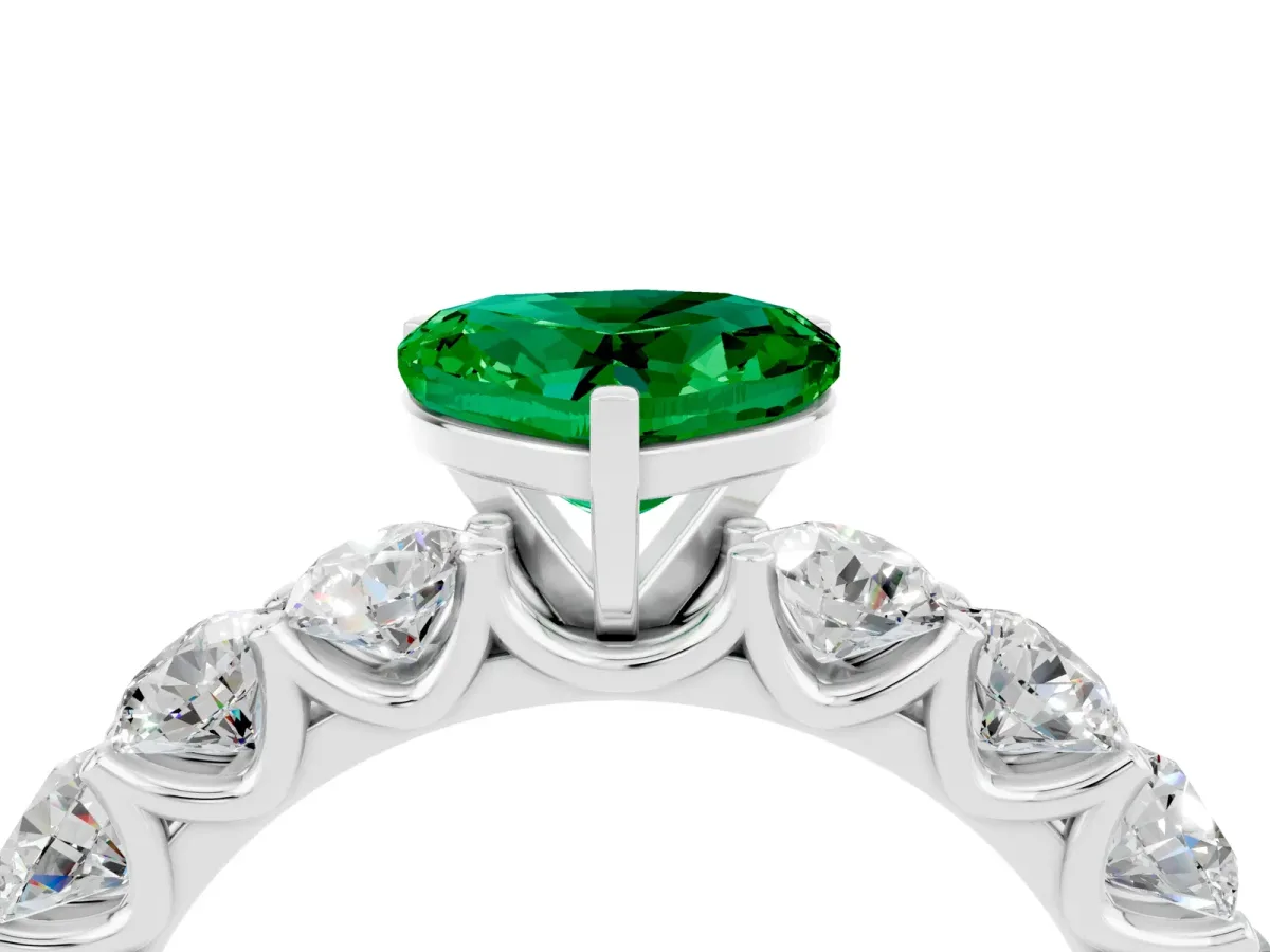Heart Cut Emerald Prong Setting with Side Stones on a Pave Band Platinum