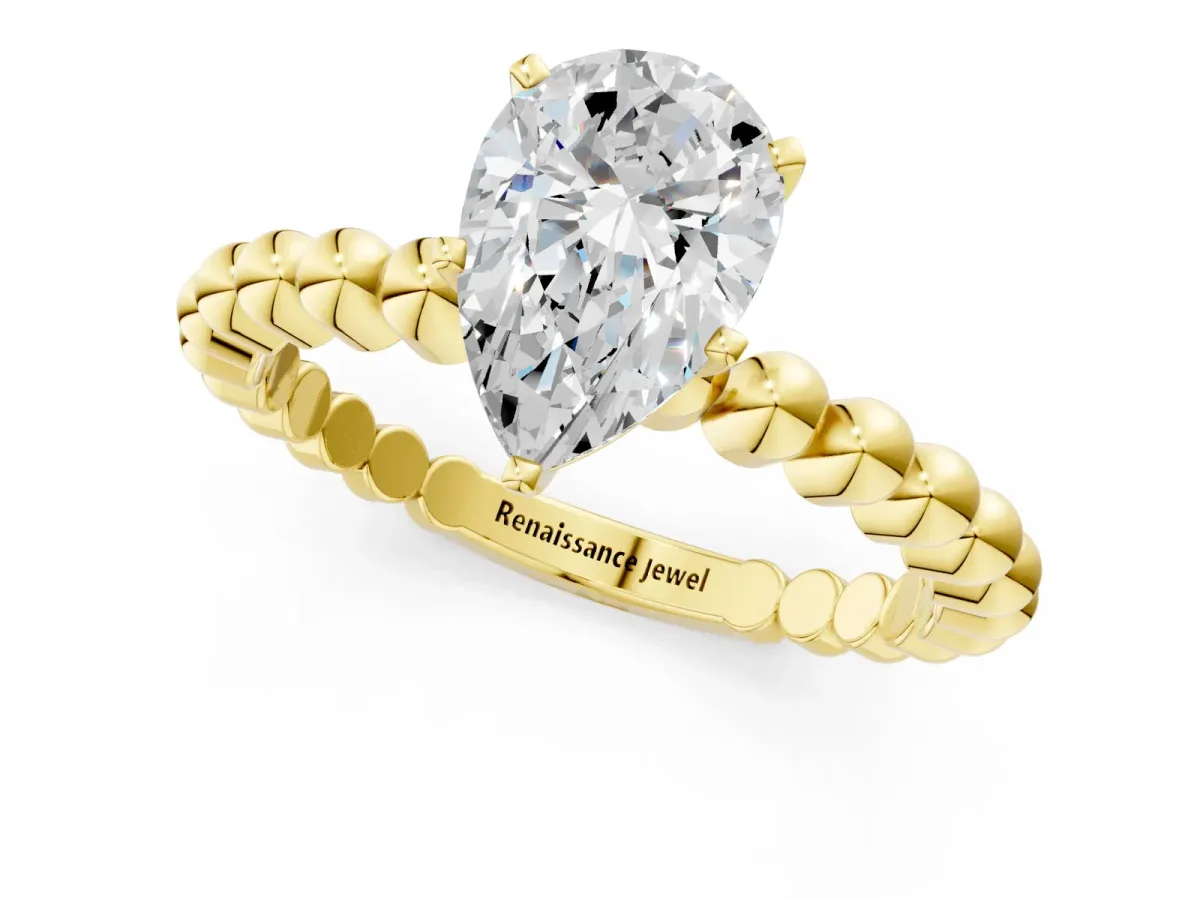 Pear Cut Diamond Solitaire Ring with Beaded Band and Prong Setting Yellow gold