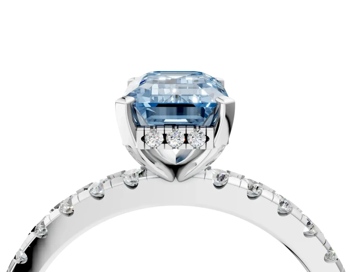Fancy Blue Emerald Cut Diamond Solitaire Ring with Round Pavé Band and Four-Prong Setting Silver