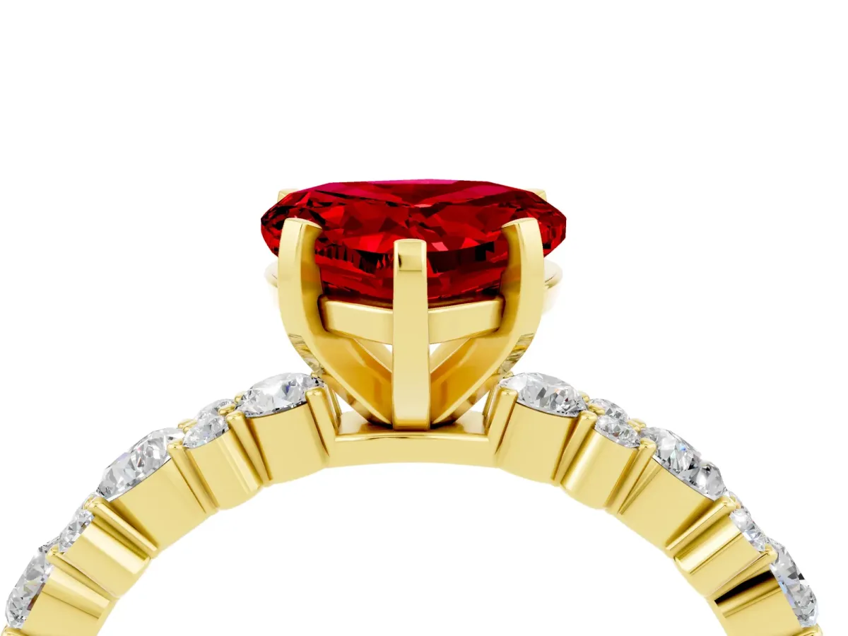 Heart Cut Ruby Side Stone Solitaire Ring with Round and Four-Prong Setting Yellow gold