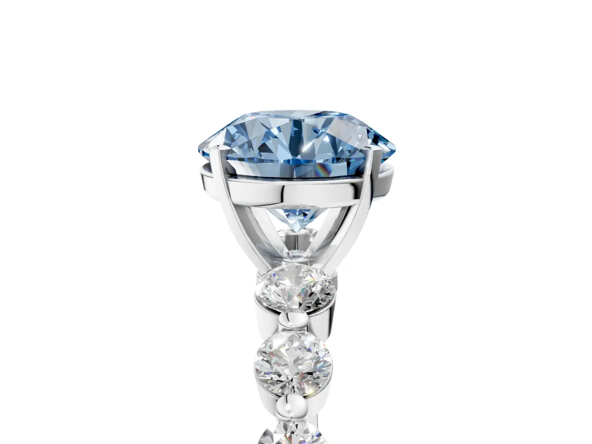 Fancy Blue Round Cut Solitaire Diamond Ring with Pave Band and Four-Prong Setting Silver