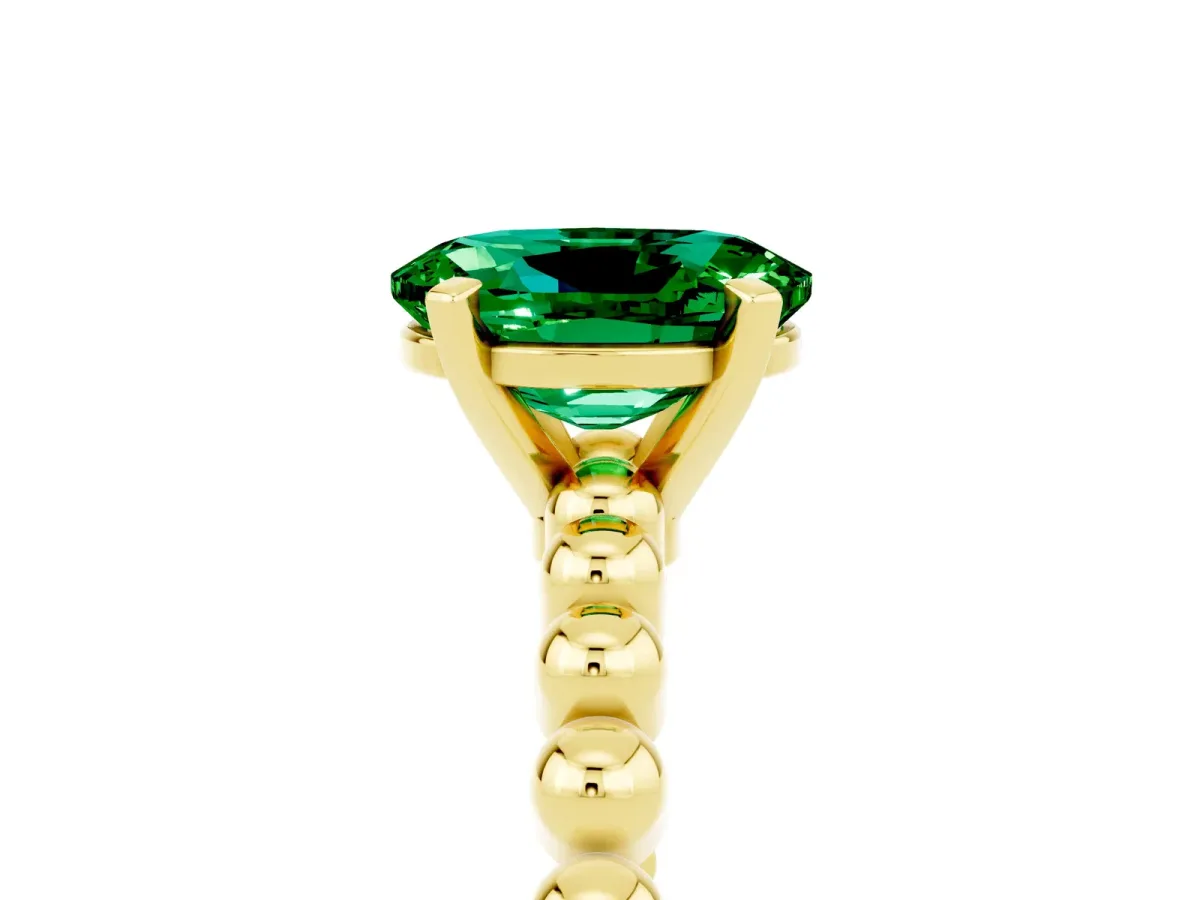 Oval Cut Emerald Solitaire Ring with Beaded Band and Prong Setting Yellow gold