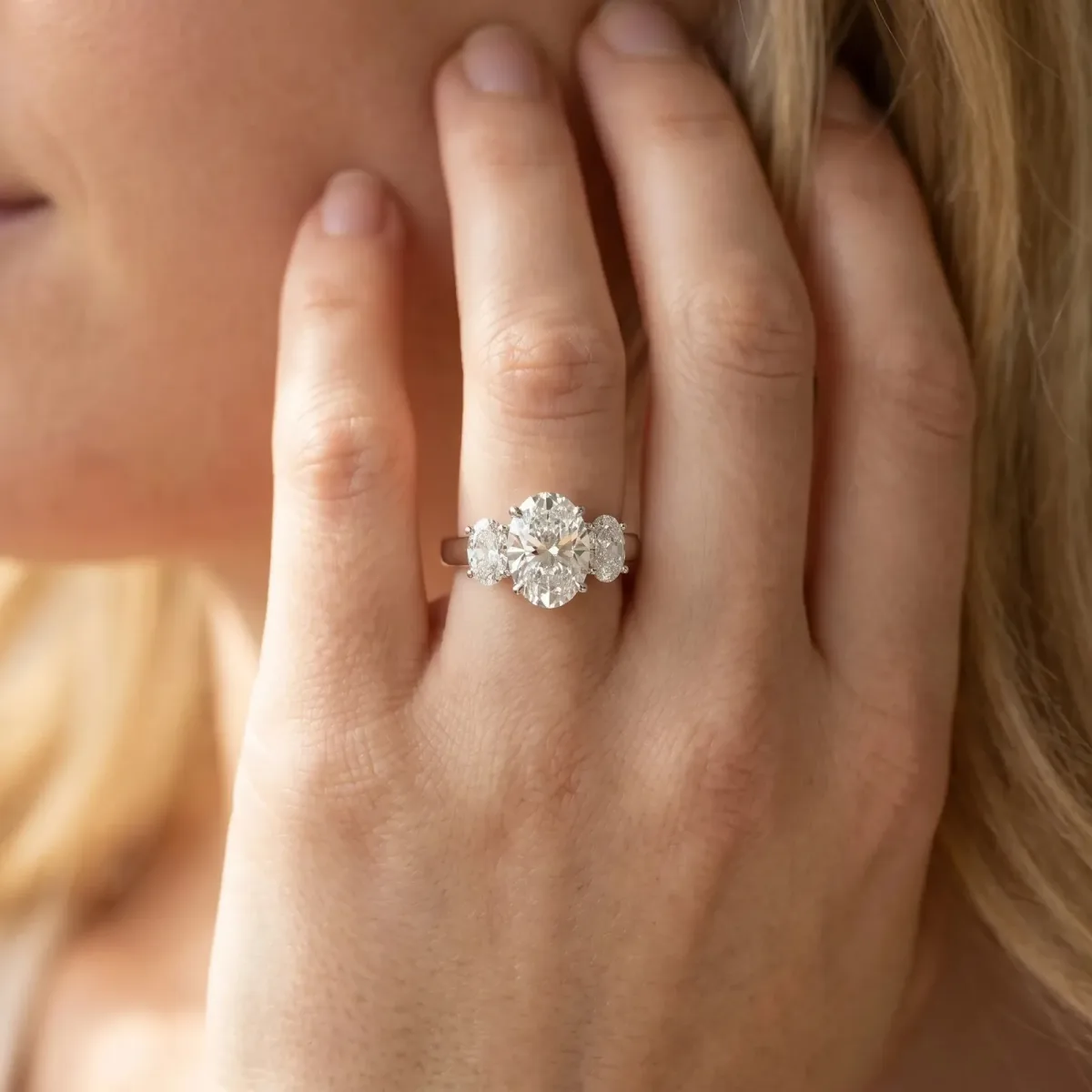 Asscher Cut Three-Stone Diamond Ring with Prong Setting on a Classic Band Platinum