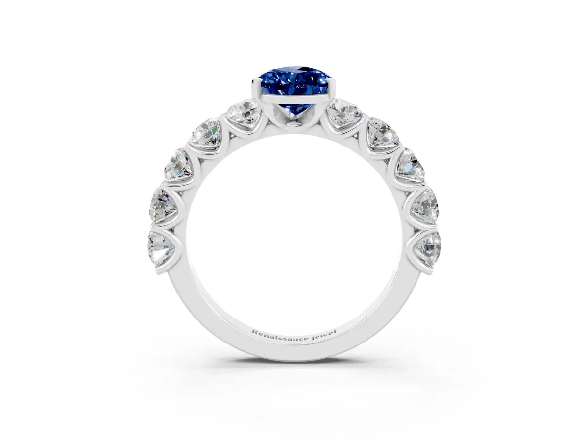 Pear Cut Blue Sapphire Prong Setting with Side Stones on a Pave Band Silver