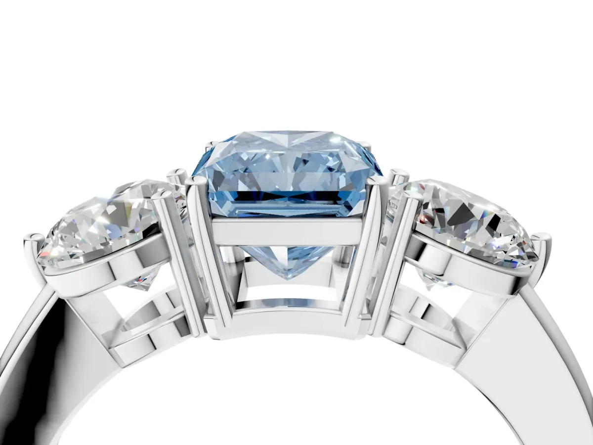 Fancy Blue Radiant Cut Diamond Three-Stone Ring with Prong Setting and Classic Band Platinum