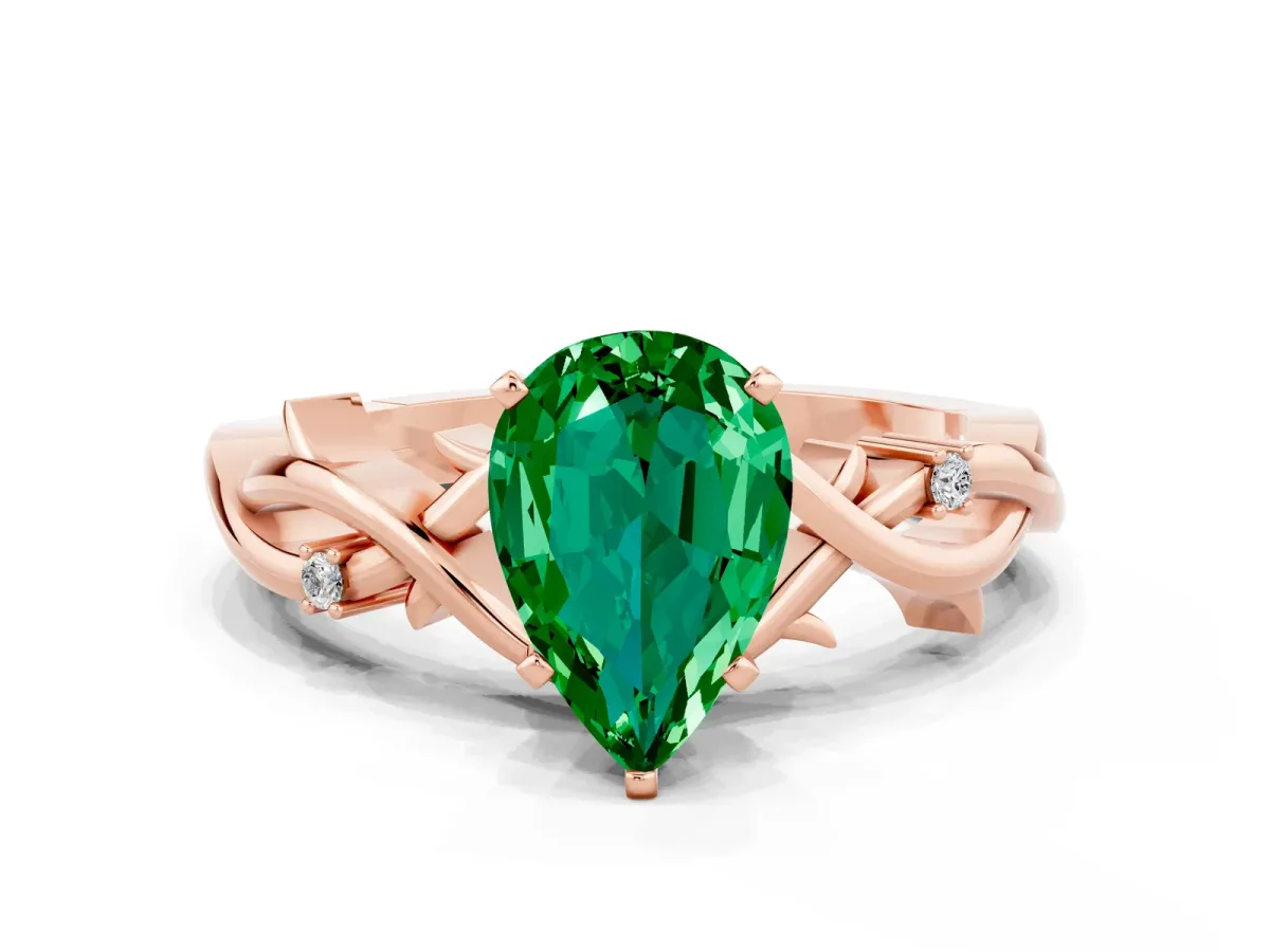 Pear Cut Emerald Solitaire Ring with Twisted Band and Prong Setting Rose gold