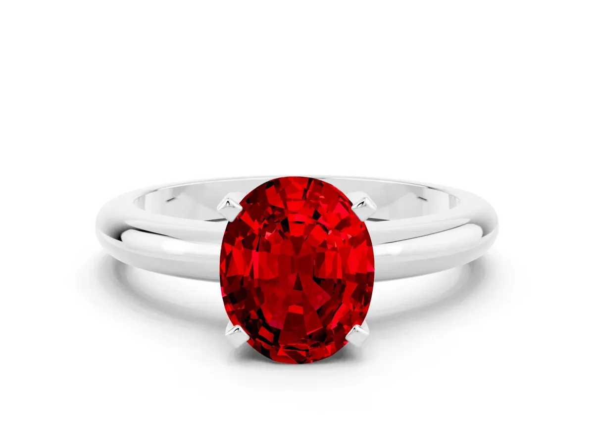 Oval Cut Ruby Solitaire Engagement Ring with Round Band and Four-Prong Setting Silver