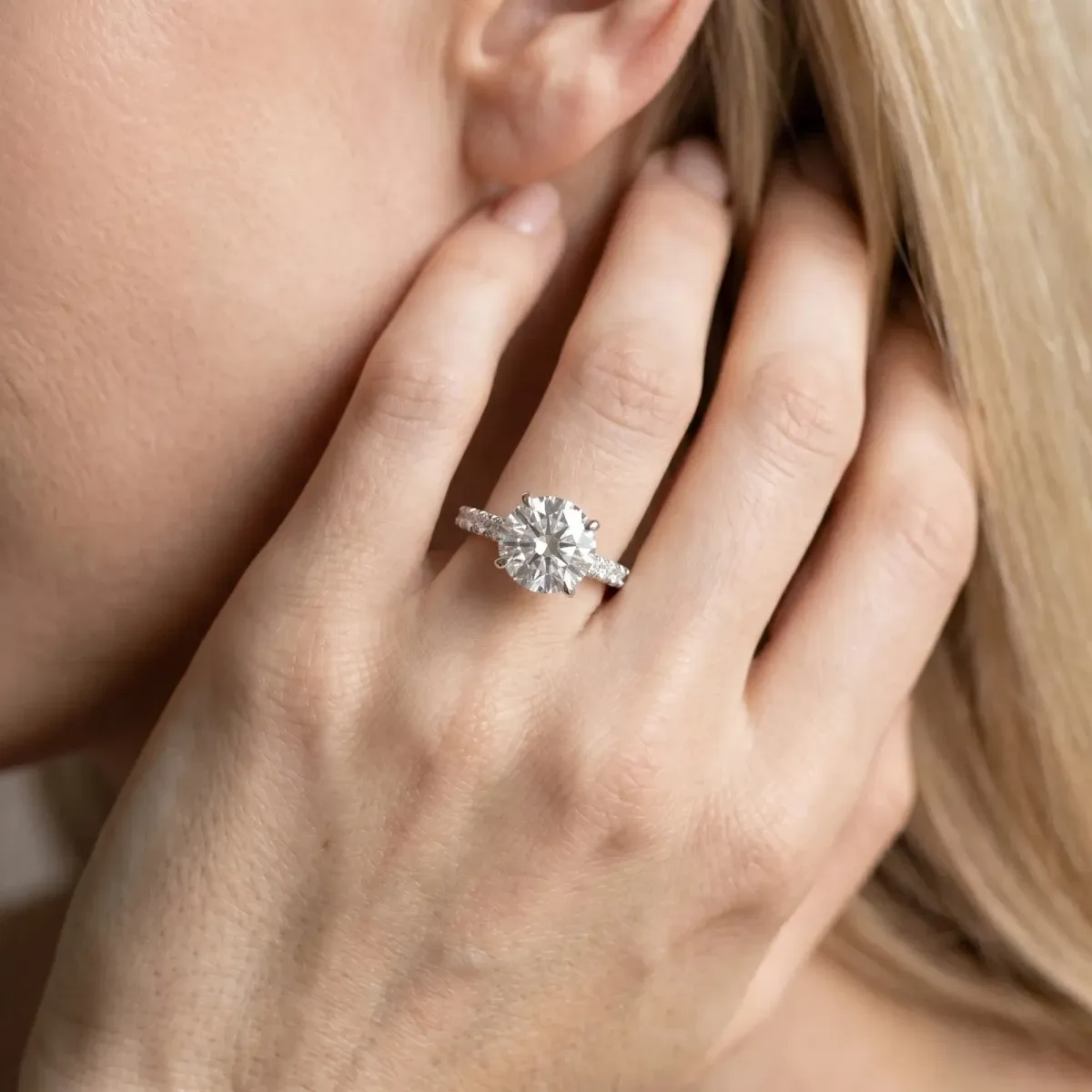 Round Cut Diamond Solitaire Ring with Round Pavé Band and Four-Prong Setting Platinum
